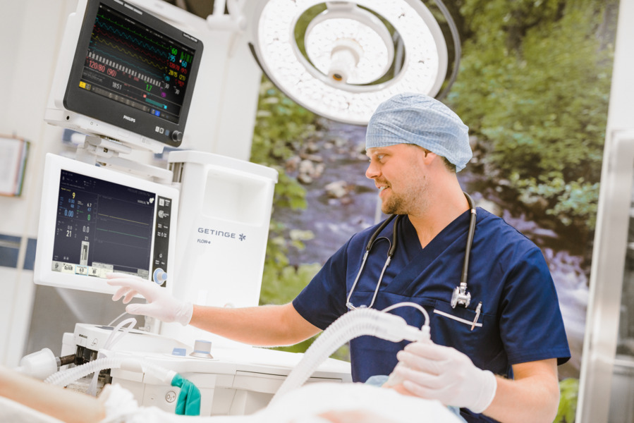 Patient and caregiver using a flow-e anesthesia machine  