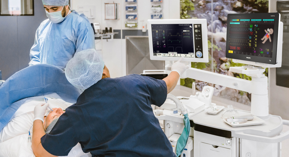 Patient under anesthesia with caregivers
