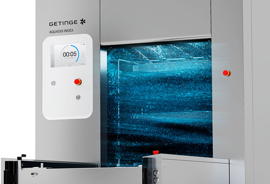 Sterilization machine with digital display reading 00:05, blue sterilizing chamber visible.