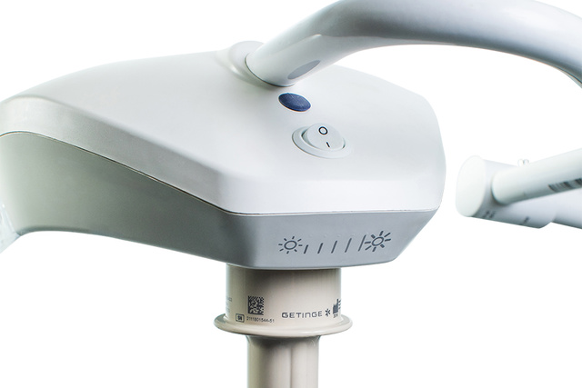 capacitive control for adjustment of the lighting intensity of an examination light