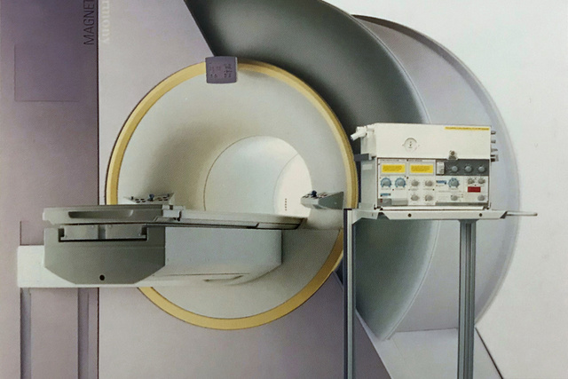 Servo 900 mechanical ventilator on mobile cart positioned next to Magnetic resonance imaging MRI machine in MR-suite